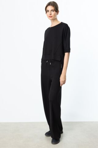 On Asimetrik Kesim Yarım Kollu Bluz ve Beli Lastikli Fermuar Cepli Eşofman Takımı