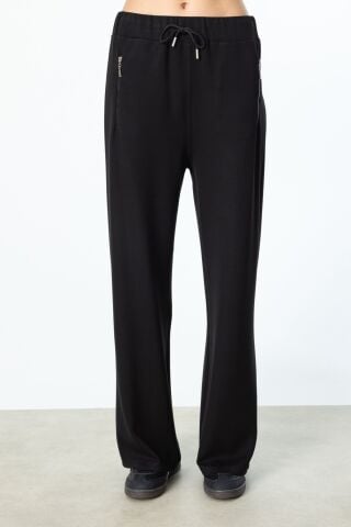 On Asimetrik Kesim Yarım Kollu Bluz ve Beli Lastikli Fermuar Cepli Eşofman Takımı